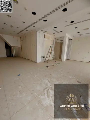 Prime Location | Large shop with a mezzanine and spacious area in Rawda 2 | 900 sq ft | Bathroom | Close to all services and near Sheikh Ammar Street