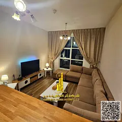 Luxury one-bedroom apartment with a balcony and open views. Ajman City Tower. Fully furnished, avail
