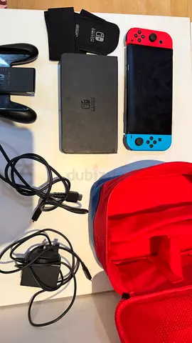 Nintendo Switch console with dock, Joy-Con controllers, case and chargers - used