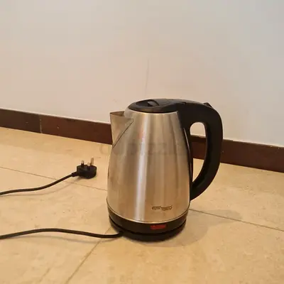 Used stainless steel electric kettle with base - good condition