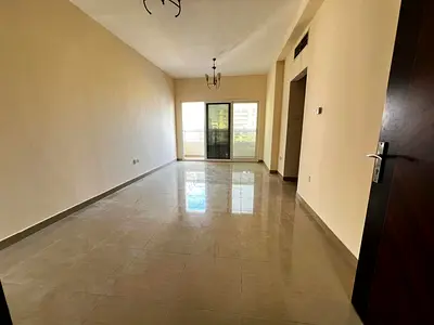 One bedroom and living room for rent in Al Taawun, with parking and balcony.