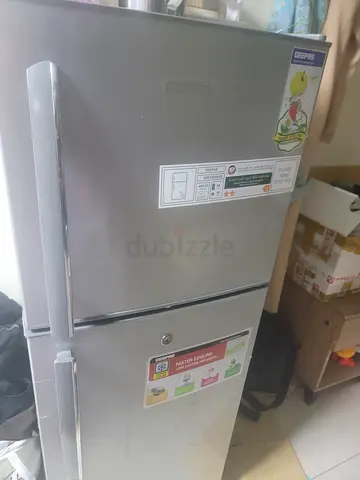 Silver double-door refrigerator in good working condition