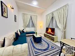 Luxurious two-bedroom apartment with a living room, fully furnished, and featuring a balcony. Ajman,