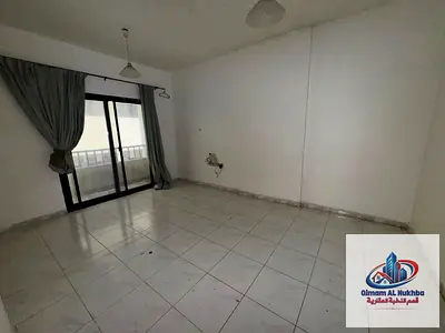 Apartment for annual rent in Sharjah, Al Qasimia Al Nud area. High-end finishing, prime location close to services and the main road, central air cond