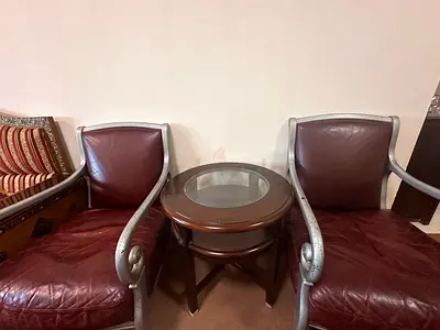 Pair of Burgundy Leather Armchairs with Round Wooden Side Table
