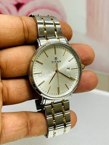 Titan men’s stainless steel watch with gold accents – used