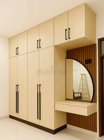 Built-in Beige Wardrobe with Vanity Mirror and Overhead Storage