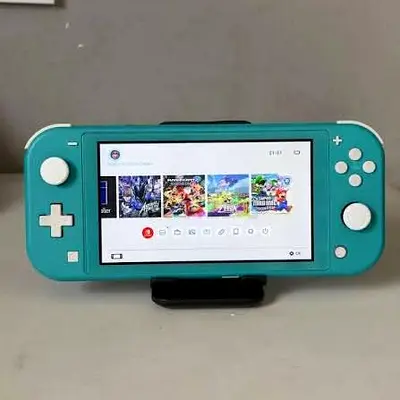 New Nintendo switch lite never used turquoise color with case