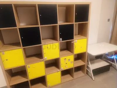 Wooden cube shelving unit with lockable yellow  black doors