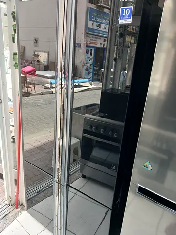 Used stainless steel fridge and gas oven combo - good condition