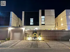 Luxury villa for sale in Al Bahia area, featuring two floors and a rooftop terrace. Modern design, s
