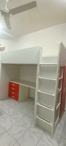 White loft bunk bed with built-in desk, ladder and drawers