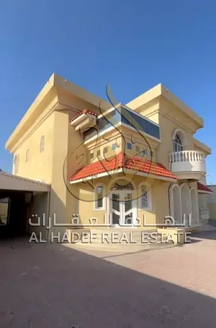 "Luxury family residence in the heart of Wasit | 5 spacious rooms + balcony | Covered parking and outdoor seating area"