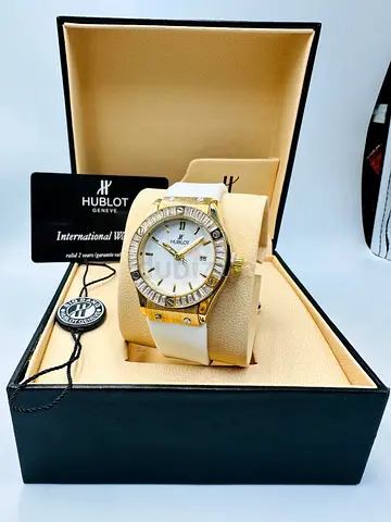Hublot men’s  Watch with White Strap and Gold-tone Bezel