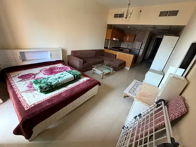Furnished studio apartment in Tower C, Al Nuaimiya 1, Ajman. Free parking, balcony, and free maintenance.