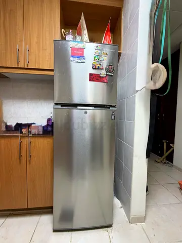Silver double-door refrigerator, top freezer - good working condition