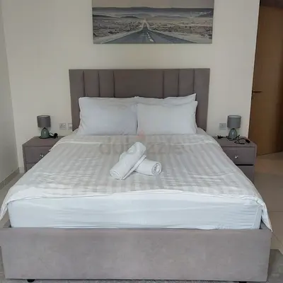 Queen-size upholstered bed frame with headboard