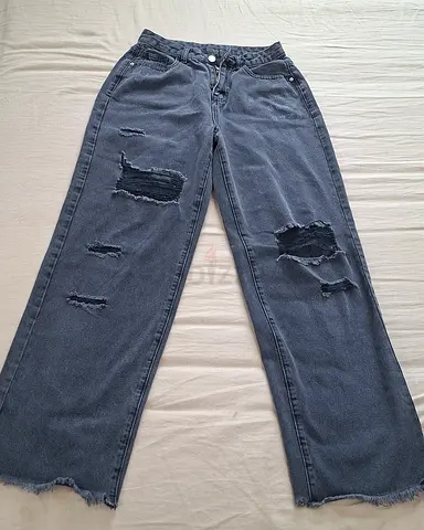Worn-in black ripped straight-leg jeans — size approx M/L