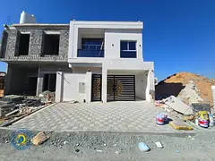 In Al-Haliyo 2, own a luxurious 5-bedroom villa with a rooftop terrace, including registration fees,