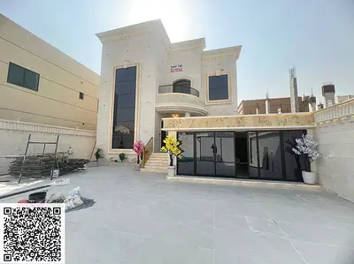 Commercial villa for sale in Al Muwaihat 1 area | Includes electricity, water, and air conditioning | Freehold ownership for all nationalities | Close