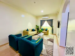 Luxury two-bedroom apartment with a spacious living room and balcony, fully furnished. Ajman, Al Muw