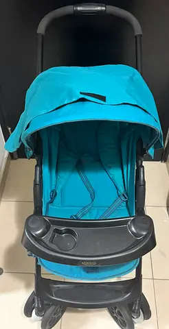 Lightweight teal baby stroller - good condition