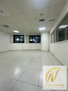 A distinctive office for annual rent in Al Rashidiya Falcon Towers 2, next to all services, with a s