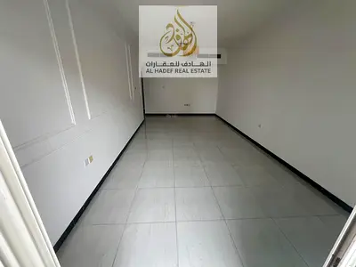 2-bedroom apartment for rent in Ajman Al Mowaihat 3. Includes 2 bathrooms, balcony, central AC, prime location opposite Choueifat School. Rent AED 40,