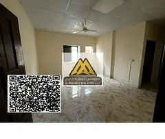 One-bedroom apartment with a living room in Al Rashidiya 1, prime location on Al Mina Street opposit