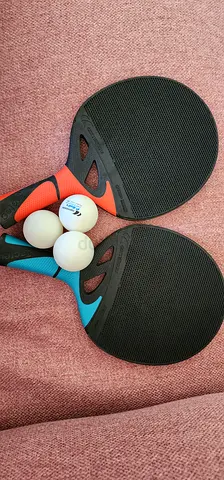 Ping pong rackets and 3 balls
