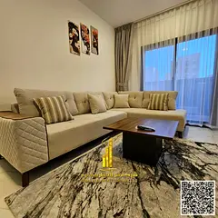 Beautiful furnished one-bedroom apartment with new furniture for monthly rent in Ajman - Corniche -