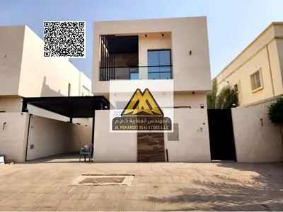A brand new villa for sale in Al Muwaihat 2, Ajman, right next to the mosque. It features a luxurious design, spacious areas, high-quality finishes, e