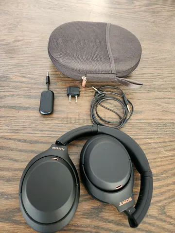 Sony WH-1000XM4 Wireless Noise Cancelling Headphones with Sony Case and Accessories for flying.
