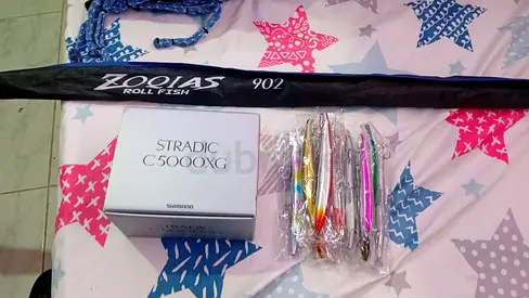 Fishing rod and Shimano Stradic C5000XG reel with lures