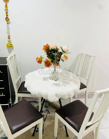 Round tea table set with 4 cushion chairs