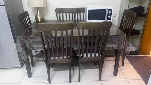 Home box Dining Table and 6 chairs in new condition for 400 Aed only