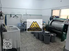 For annual rent in Ajman – Al Rashidiya, near Amina Hospital Street: a fully equipped laundry shop
