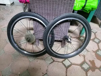 Pair of used 20 bicycle wheels with tires and cassette