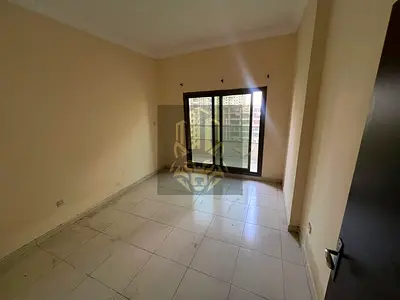2BR apartment for rent in Emirates City, 2 baths & balcony with open view near MBZ Rd, AED 34,000 yearly in 4 payments