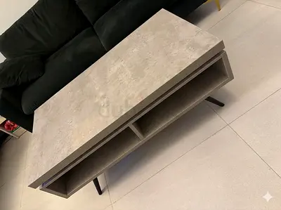 Modern concrete-look coffee table with storage, good condition