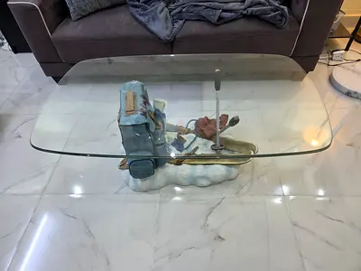 Unique Glass Top Coffee Table with Decorative Base
