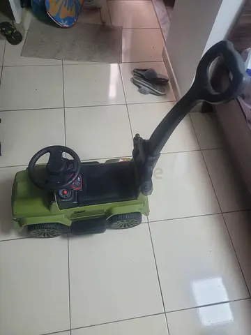 Green Push Ride-On Car with Handle and Steering Wheel