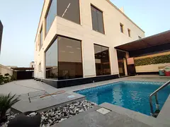 Brand new villa for sale in Al Hoshi, 5 bedrooms, smart home, central AC &amp; gas, pool, 2 floors. 