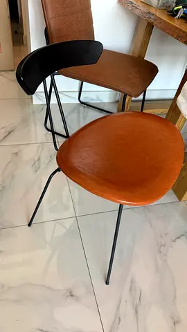 1 modern dining or office chair with faux leather seats and black metal legs