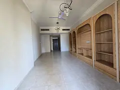 2BR Emirates City: 38K, Free Parking, Wall Closets, Direct Dubai Exit