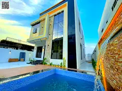Luxury villa for sale with two floors and a spacious yard, near Sheikh Mohammed Bin Zayed Road, with