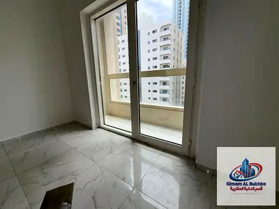 Beautiful two-bedroom apartment with a living room, close to Dubai exit, central gas, central air conditioning, family building, gym, swimming pool, f