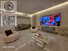 Two bedrooms and a spacious living room with a balcony offering an open view in Al Waha Towers Al Ra