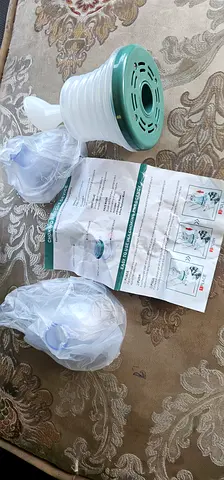 Manual Breast Pump with Spare Parts and Instructions - Good Condition