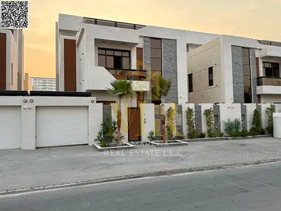 Two-story villa with a rooftop terrace and swimming pool, price includes electricity, water, and air conditioning, in one of Ajman's most prestigious